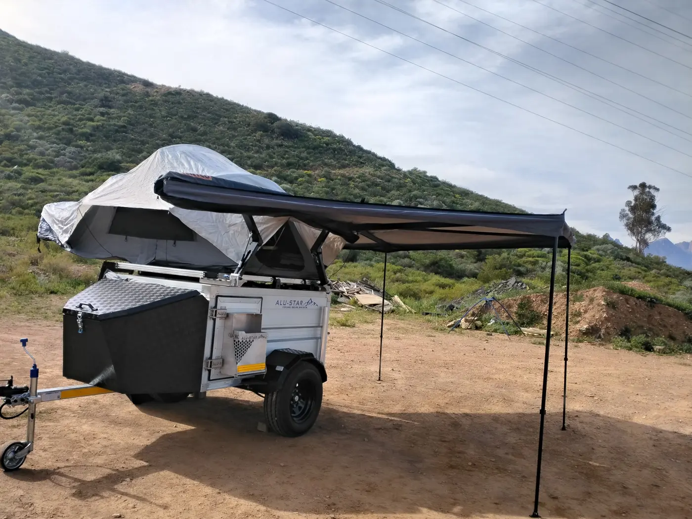 Alu-X Camper with a rooftop tent and awning