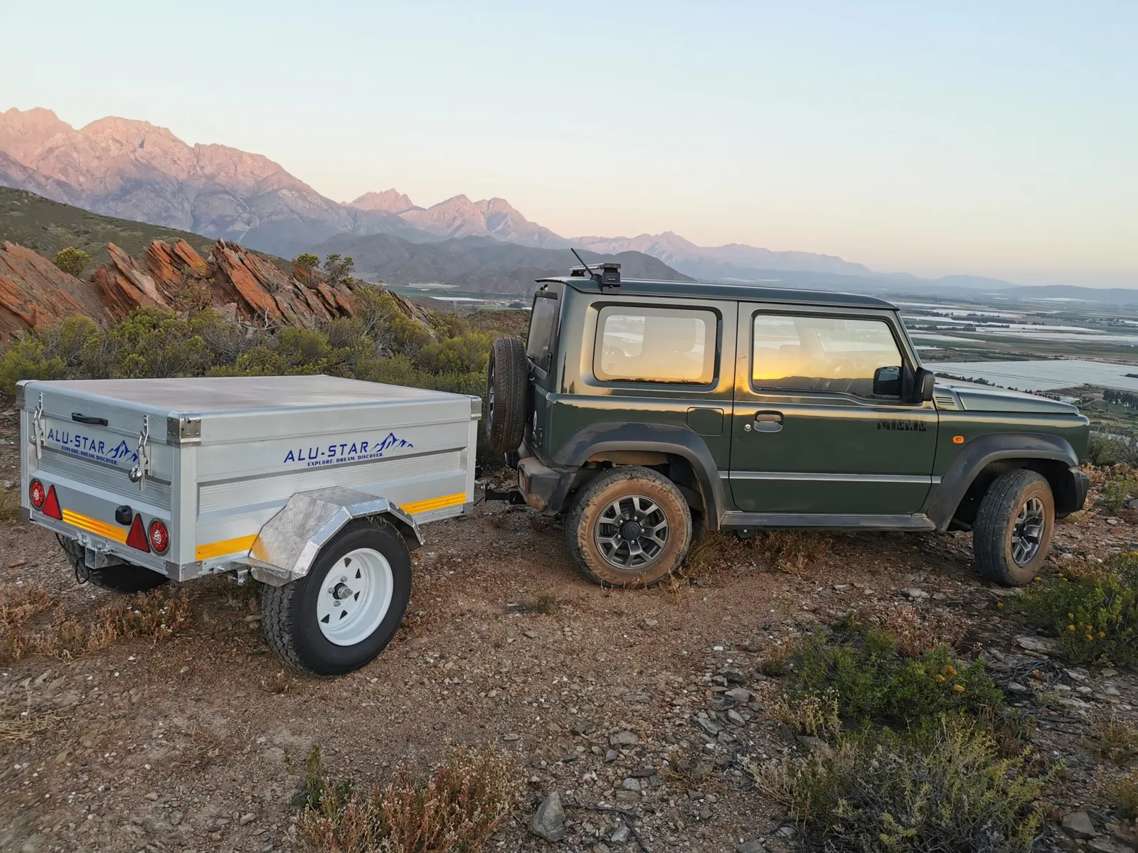 An Alu-X Utility at sunset in the mountains