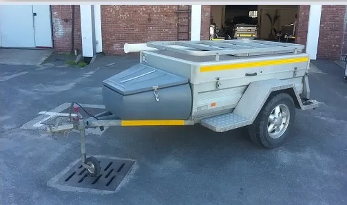 An earlier Alu-Star camping trailer with a nose box and roof rack