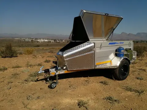 Tracker aluminium off-road trailer with the lid open, in the Karoo
