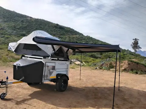 Alu-X Camper: Built up with a rooftop tent, an awning and the nose cone painted black