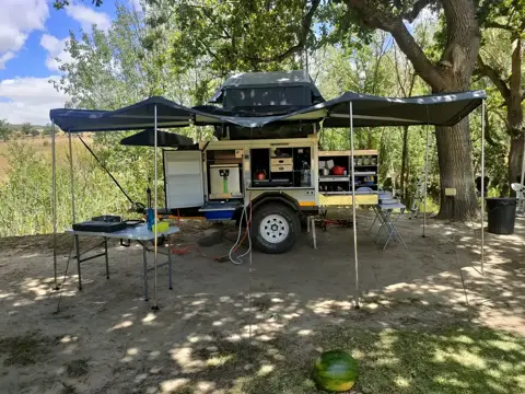 XK6: Set up with a rooftop tent and awnings (the tent and awning are your choice)
